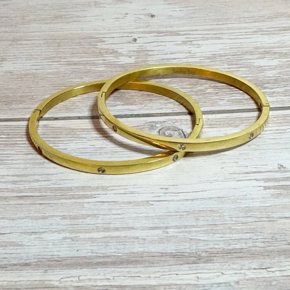 2 Gold Tone Bangle Bracelets With Rhinestone Details Stainless Steel Hinged